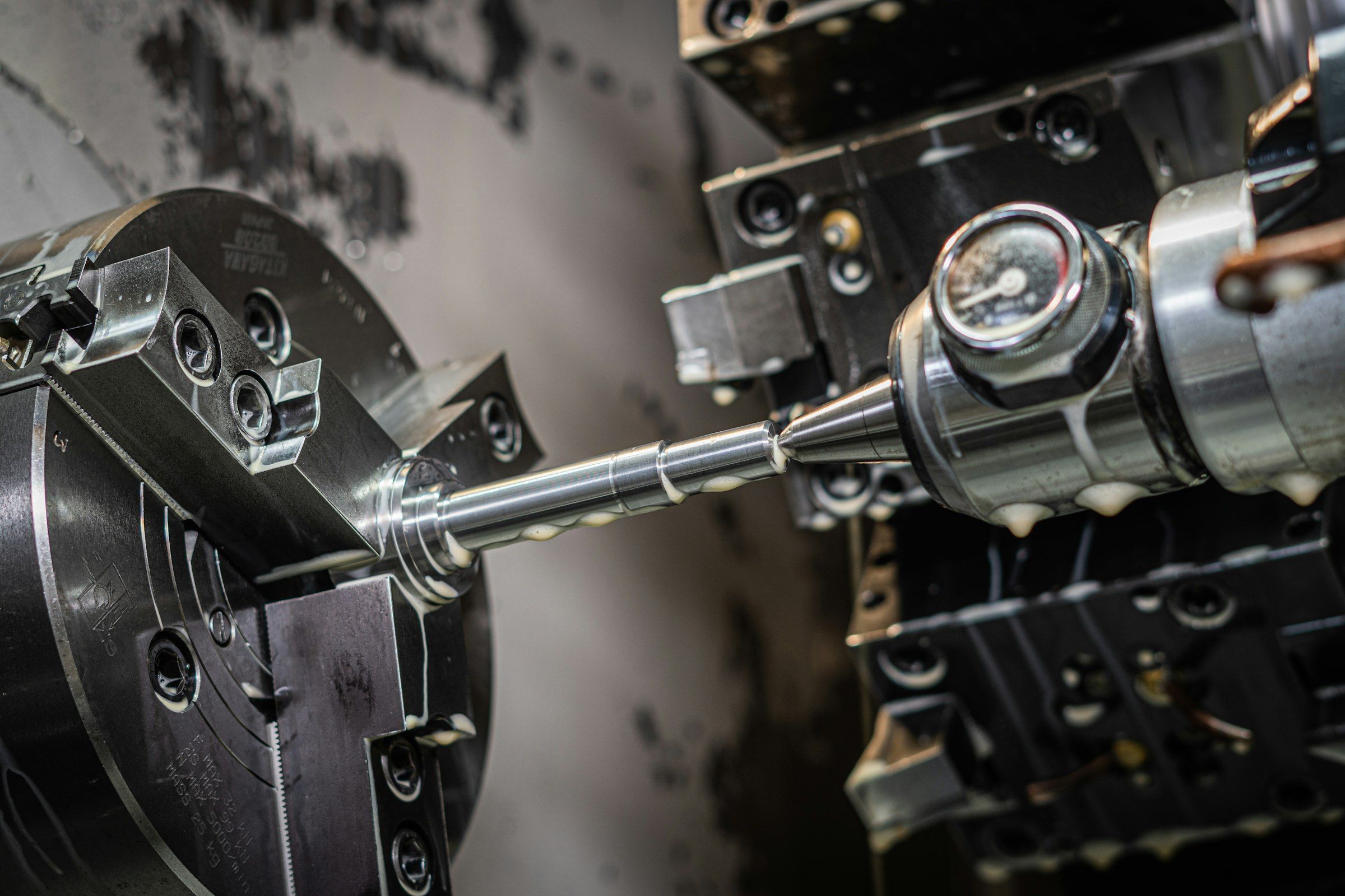 Lathe turning a precision steel part