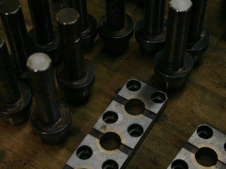 Machined steel pins and plates